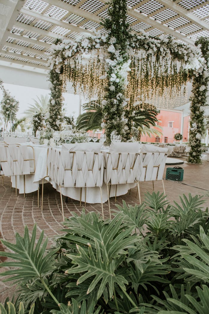 Stunning outdoor wedding setup with lush floral arrangements and elegant table settings, perfect for celebrations.